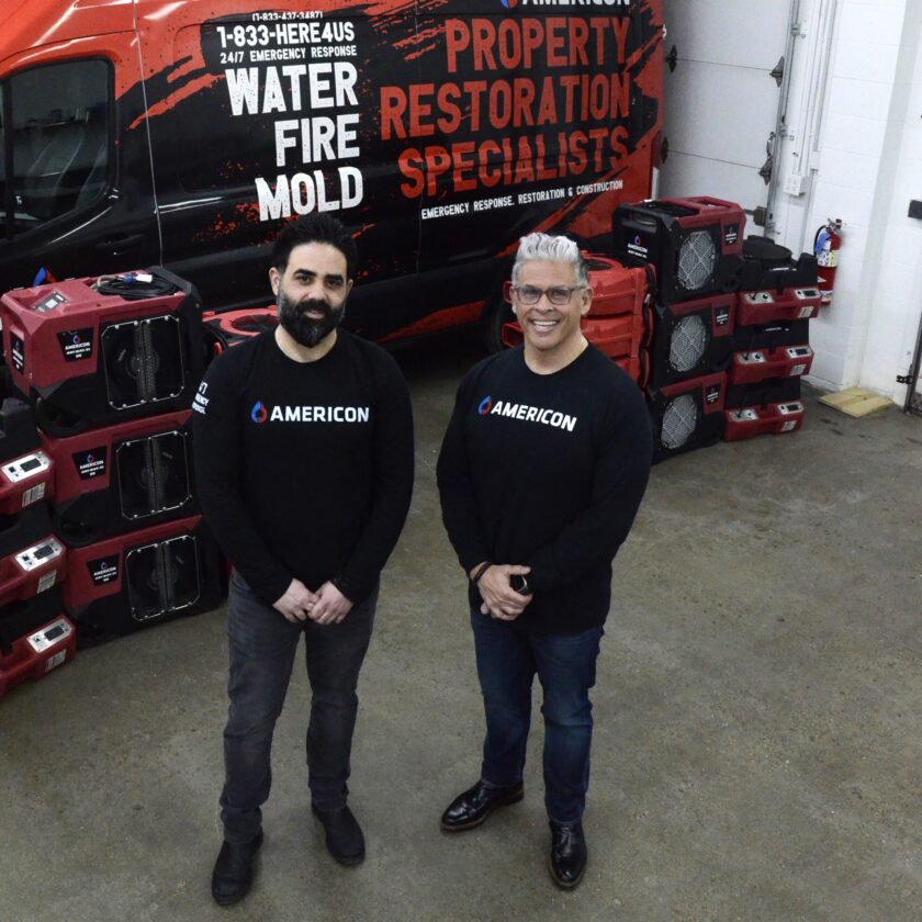 Business partners Kirk Nikolaides, left, and Yianni Coutris stand in their warehouse at Americon Restoration.